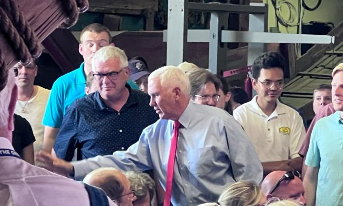 Former Vice President Mike Pence (center) greets supporters at the Indiana State Fairgrounds in Indianapolis on Aug. 2, 2022. (Lawrence Wilson / The Epoch Times)