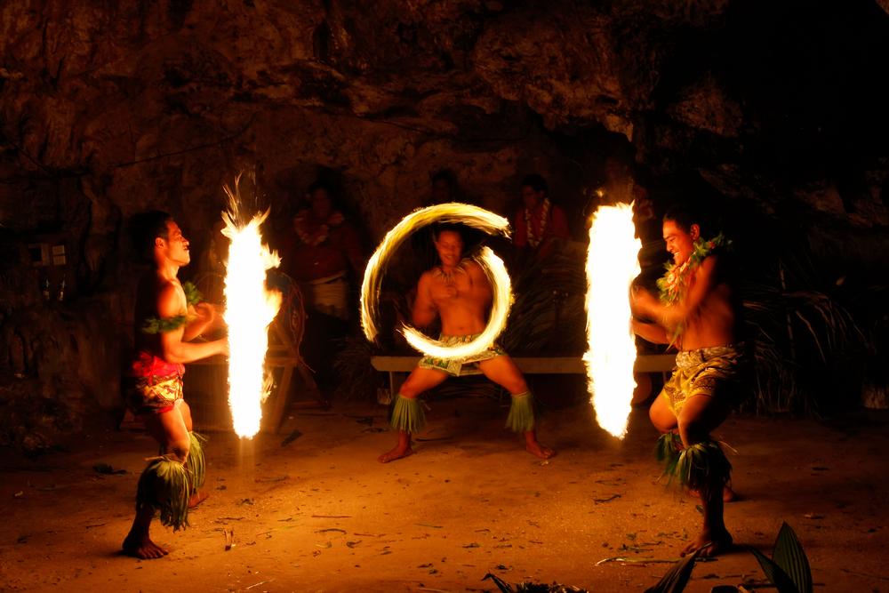 Men perform a fire dance in Hina Cave in Tongatapu, Tonga, on Nov. 13, 2013. (Don Mammoser/Shutterstock)