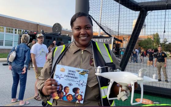 Ashley Cooper, a licensed drone pilot, founder, and president of Droneversity, had a table and tent at National Night Out in Newark on Aug. 1, 2023. (Lily Sun/The Epoch Times)