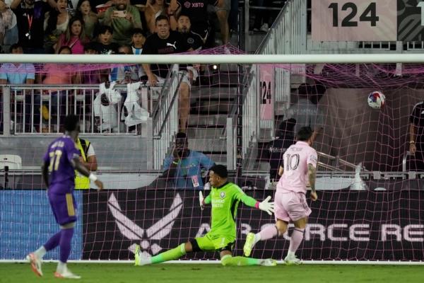 Inter Miami forward Lionel Messi (10) scores past Orlando City goalkeeper Pedro Gallese (1) during the first half of a Leagues Cup soccer match in Fort Lauderdale, Fla., on Aug. 2, 2023. (Rebecca Blackwell/AP Photo)