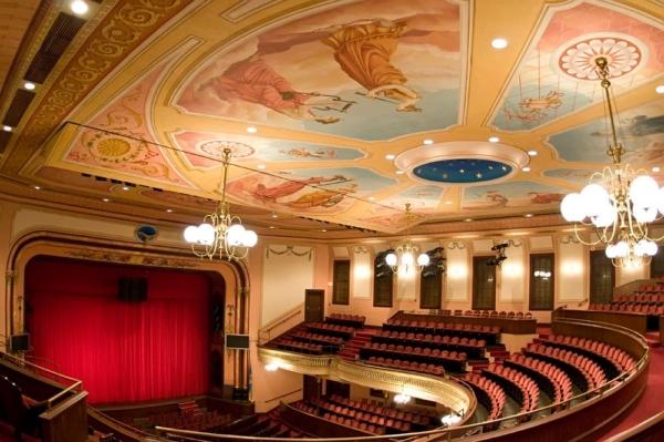Seated in the Upper Balcony, an audience member can take in the expanse of the ceiling, the chandeliers, and a bird's-eye view of the stage. (Courtesy of TheGrandWilmington)