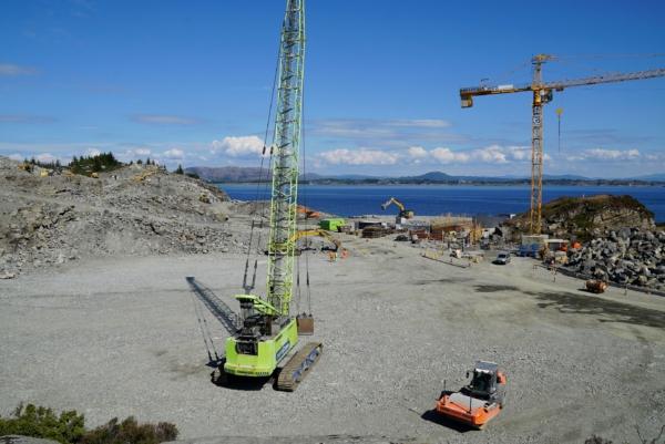 Cranes and vehicles at a construction site at the start of construction work for a terminal that will collect liquefied carbon dioxide CO2, in Oygarden near Bergen, Norway, on June 21, 2021. (Alexiane Lerouge/AFP via Getty Images)