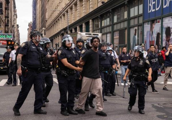 Police officers arrest a man during riots, after Twitch streamer Kai Cenat announced a "giveaway" event in New York's Union Square on Aug. 4, 2023. (Yuki Iwamura/AFP via Getty Images)