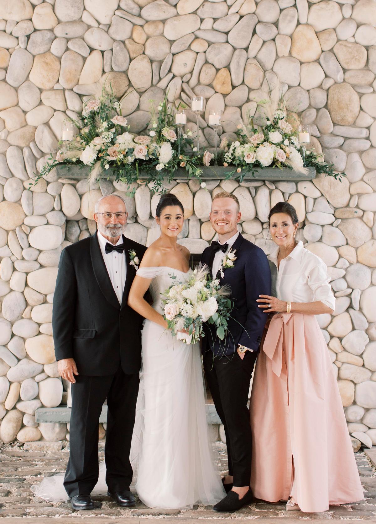 Mr. and Ms. Bishop with the bride's parents. (Courtesy of Brianna Wilbur)