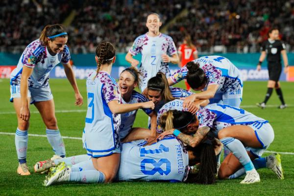 Spain's Laia Codina, obscured, is congratulated bye teammates after scoring her team's fourth goal during the Women's World Cup second round soccer match between Switzerland and Spain at Eden Park in Auckland, New Zealand, on Aug. 5, 2023. (Abbie Parr/AP Photo)