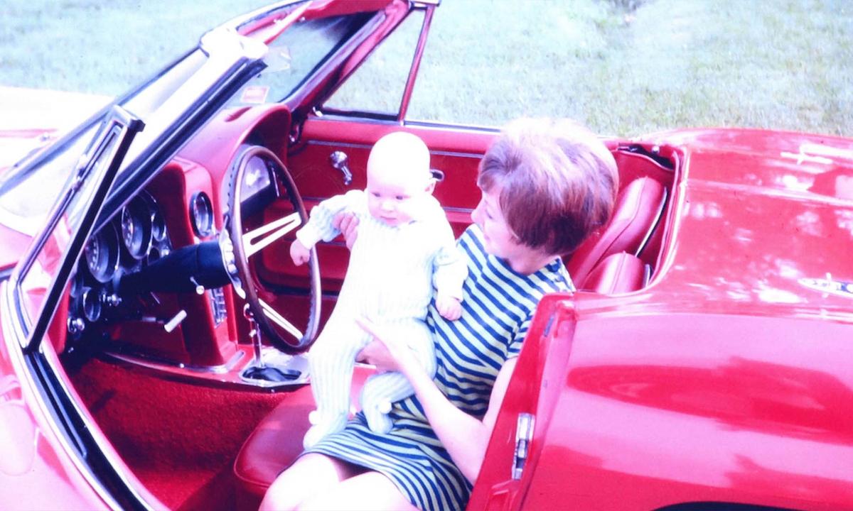 Alice and her firstborn, Chad, sitting in the family's red Corvette. (Courtesy of Brent Farrell)