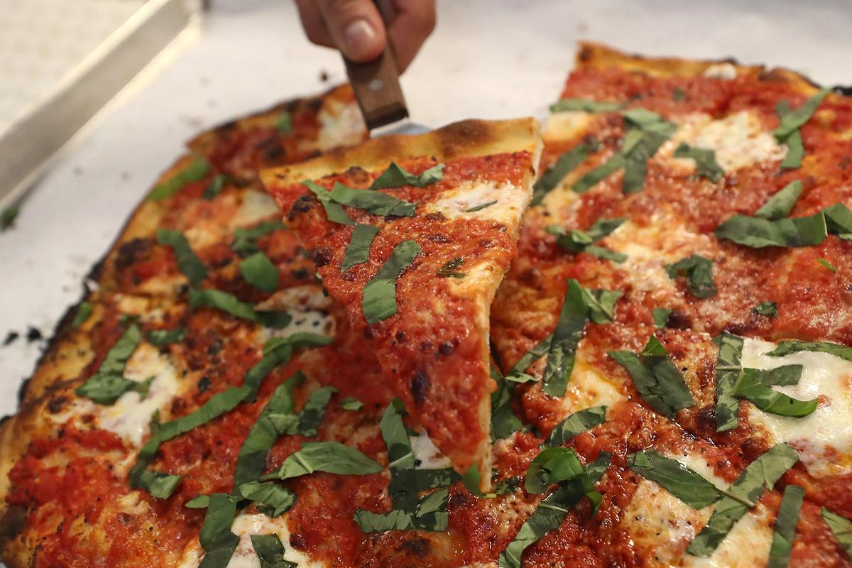 A meatball and ricotta pizza is served at Frank Pepe Pizzeria Napoletana in Delray Beach. (John McCall/Sun Sentinel/TNS)