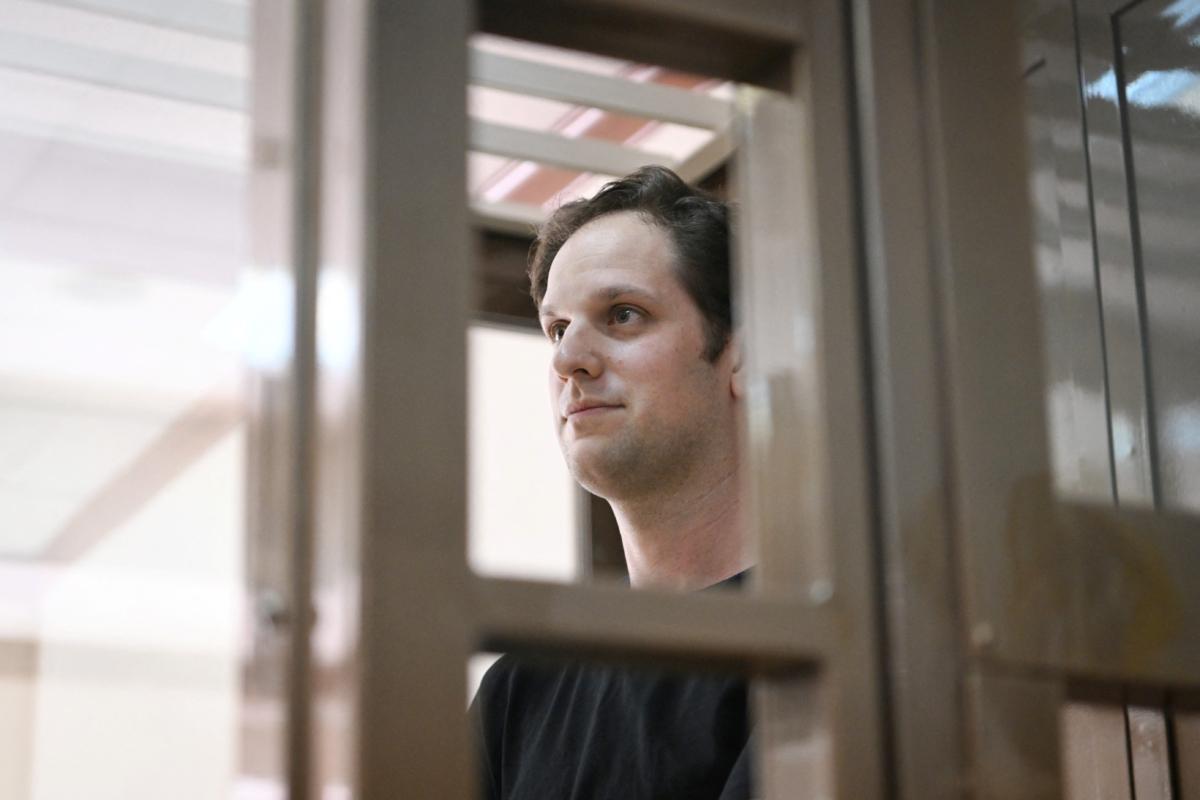 U.S. journalist Evan Gershkovich, arrested on espionage charges, stands inside a defendant's cage before a hearing to consider an appeal on his extended detention, at The Moscow City Court in Moscow, on June 22, 2023. (Natalia Kolesnikova/AFP via Getty Images)