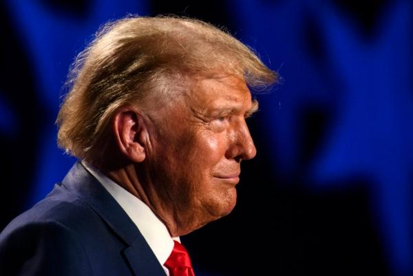 Former President Donald Trump pauses for cheers from the crowd before speaking as the keynote speaker at the 56th Annual Silver Elephant Dinner hosted by the South Carolina Republican Party in Columbia, S.C., on Aug. 5, 2023. (Melissa Sue Gerrits/Getty Images)