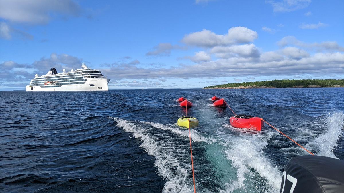 Kayaks trailed behind a Zodiac boat during an expedition from the cruise ship Viking Octantis in Lake Huron's Georgian Bay near Killarney, Ontario. (Simon Peter Groebner/Minneapolis Star Tribune/TNS)