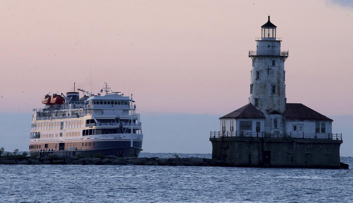 The Ocean Voyager Ship, owned by American Queen Voyages, sails along Lake Michigan as it arrives to Chicago’s Navy Pier, on sunrise, Thursday, July 14, 2022. (Antonio Perez/ Chicago Tribune/TNS)