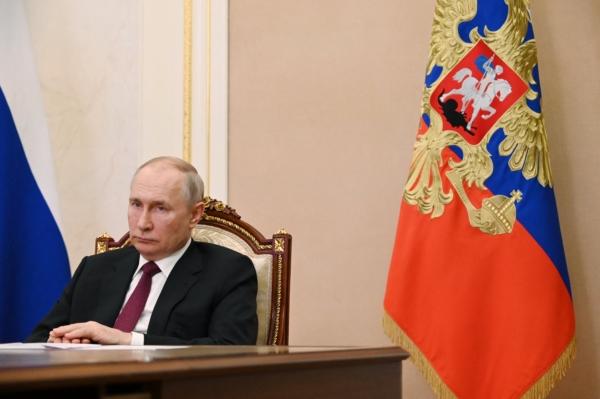 Russian President Vladimir Putin chairs a meeting with members of the government via a video conference at the Kremlin in Moscow on July 19, 2023. (Photo by Alexander KAZAKOV / SPUTNIK / AFP)