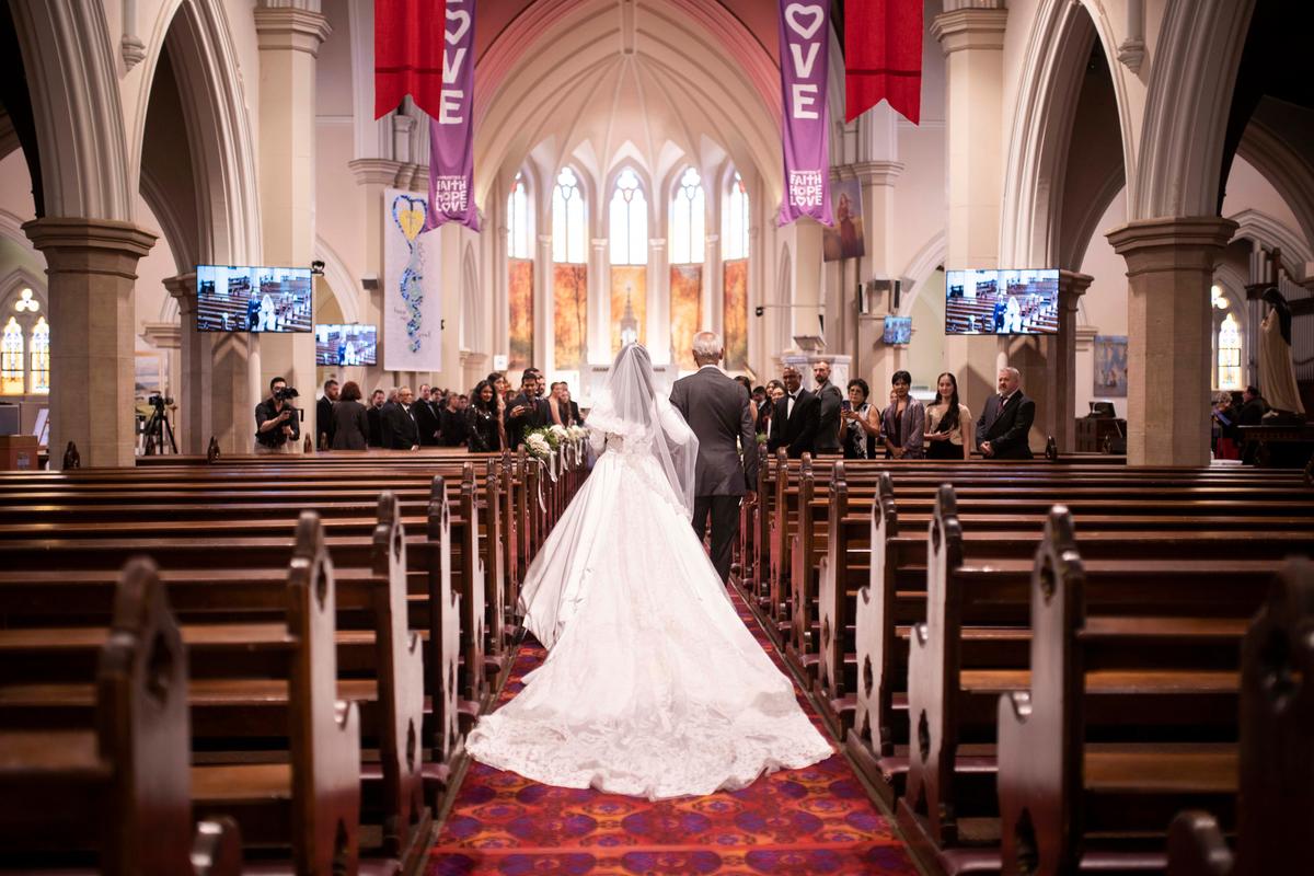 Carol D'Silva's father walking her down the aisle. (Courtesy of Carol D'Silva)