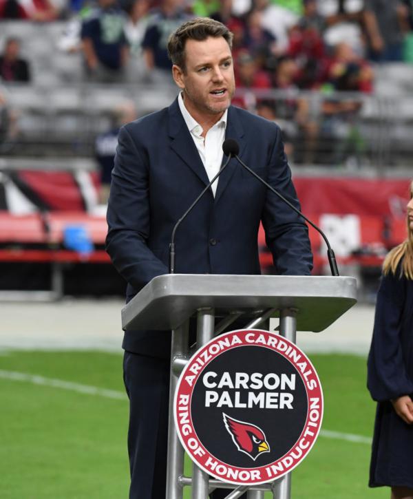 Former Arizona Cardinals quarterback Carson Palmer talks to the fans after being inducted into the Cardinals Ring of Honor at halftime of a game against the Seattle Seahawks at State Farm Stadium in Glendale, Ariz., on Sept. 29, 2019 (Norm Hall/Getty Images)
