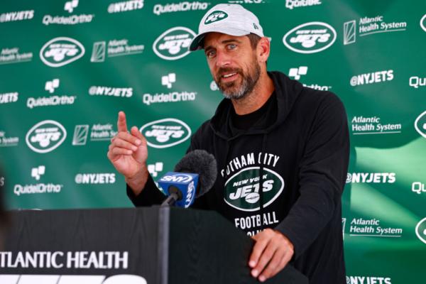 Quarterback Aaron Rodgers (8) of the New York Jets talks to reporters after training camp at Atlantic Health Jets Training Center in Florham Park, N.J., on July 26, 2023. (Rich Schultz/Getty Images)