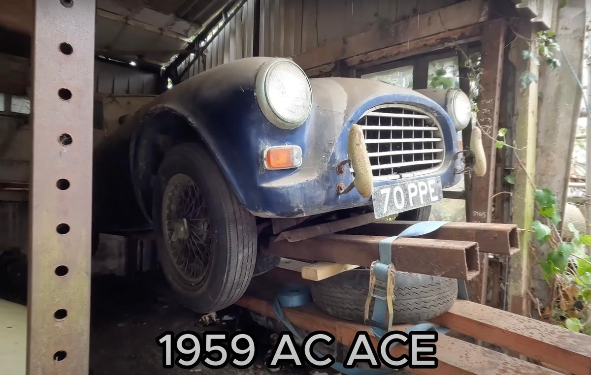 A 1959 AC ACE is being removed from the barn by a forklift. (Courtesy of Anglia Car Auctions)