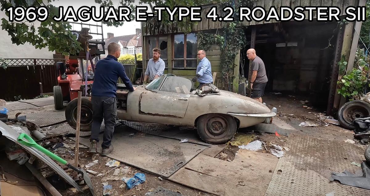 A 1969 Jaguar E-Type car is removed from the confines of a barn, where David Brown kept his collection. (Courtesy of Anglia Car Auctions)