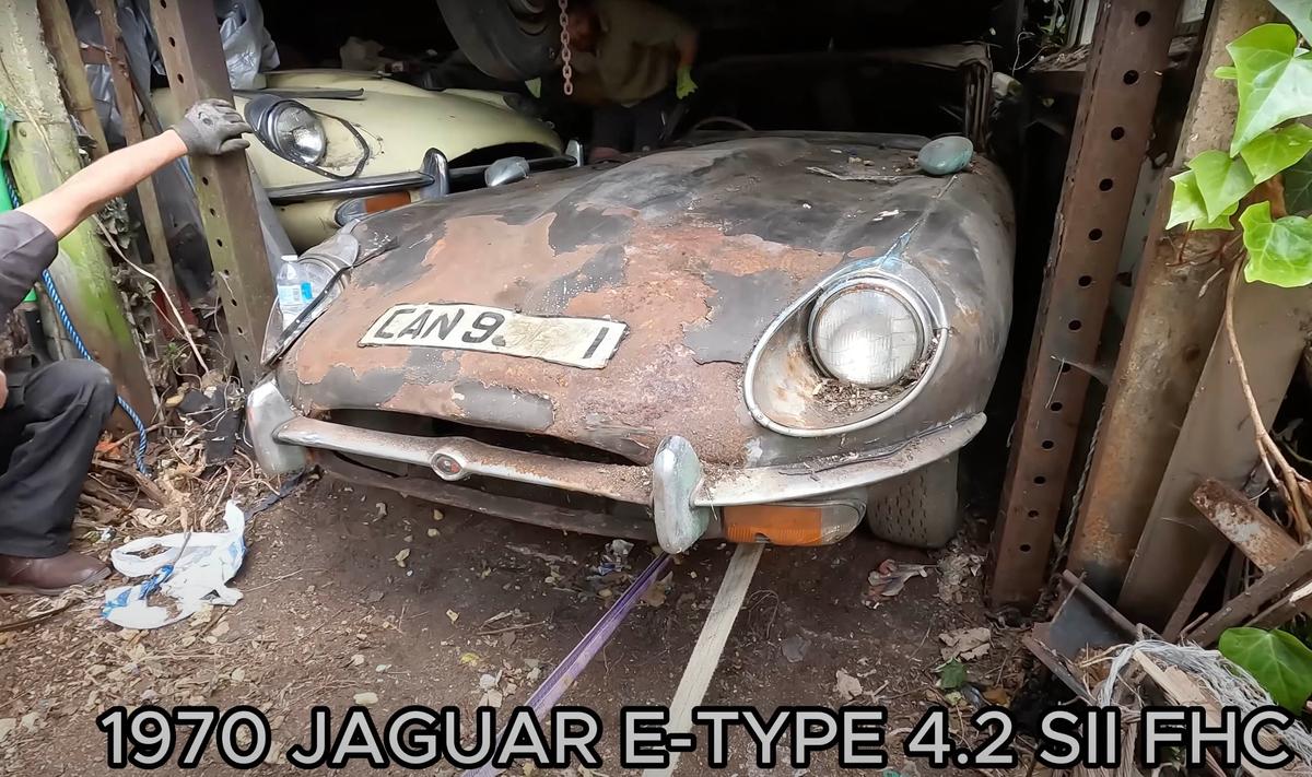 A 1970 Jaguar E-Type being extracted from the forlorn barn. (Courtesy of Anglia Car Auctions)