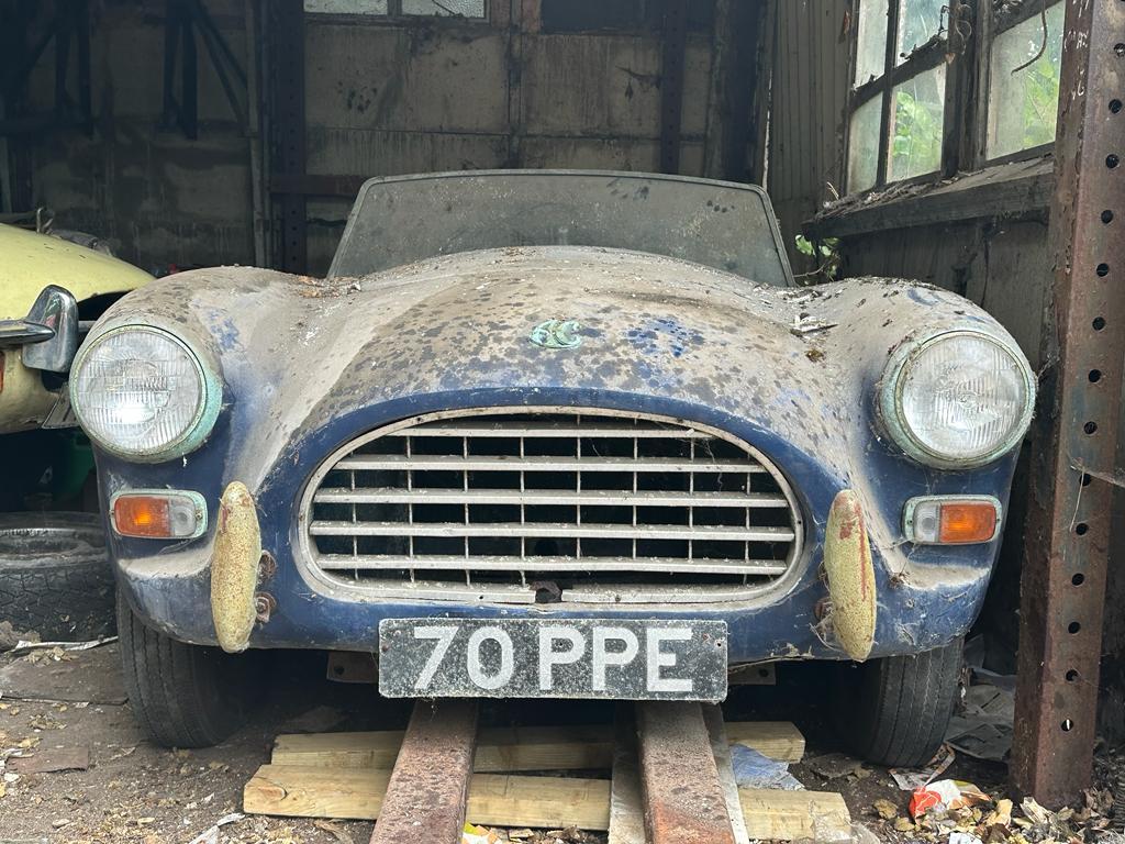 A derelict 1959 AC ACE car inside a forlorn barn in the south of England. (Courtesy of Anglia Car Auctions)