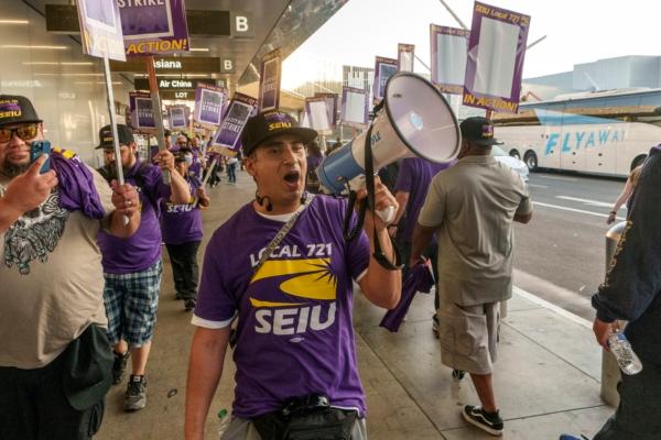 SEIU Local 721 joins a picket line at the Los Angeles International Airport in Los Angeles on Aug. 8, 2023. (Damian Dovarganes/AP Photo)
