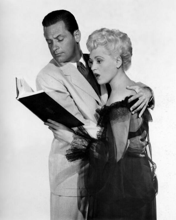 Publicity photo of William Holden and Judy Holliday for the 1950 film "Born Yesterday." (Public Domain)