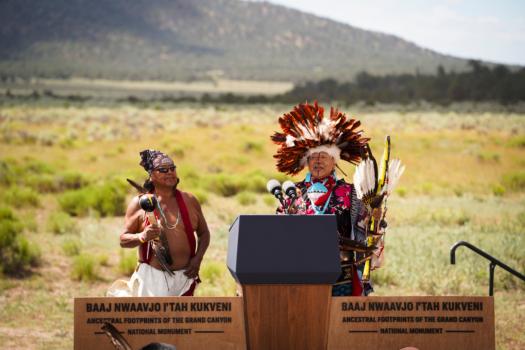 Local tribe leaders celebrate before President Joe Biden speaks and signs a proclamation making the Baaj Nwaavjo I'tah Kukveni Ancestral Footprints of the Grand Canyon National Monument at Red Butte Airfield, Ariz., on Aug. 8, 2023. (Madalina Vasiliu/The Epoch Times)