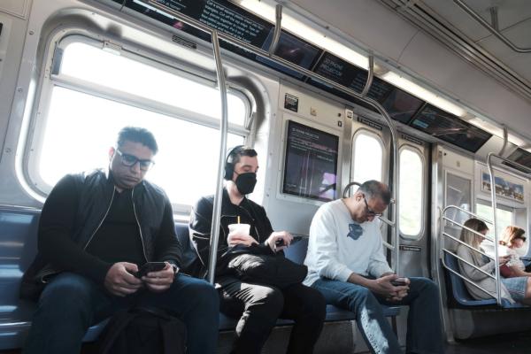  People, some still wearing masks, ride a subway in Brooklyn in New York City, on May 11, 2023. (Spencer Platt/Getty Images)