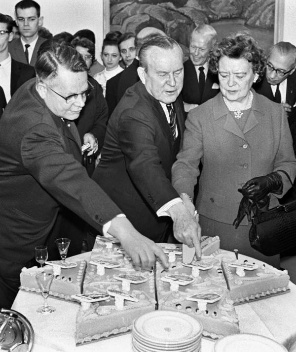 Former prime minister Lester B. Pearson (C) looks over his birthday cake with wife Maryon Pearson and former cabinet minister J. W. Pickersgill in Ottawa on April 21, 1976. (The Canadian Press Images/Chuck Mitchell)
