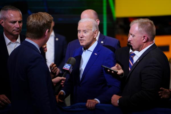 President Joe Biden talks to a Fox News reporter at Arcosa Wind Towers Inc.'s manufacturing plant in Belen, N.M., on Aug. 9, 2023. (Madalina Vasiliu/The Epoch Times)