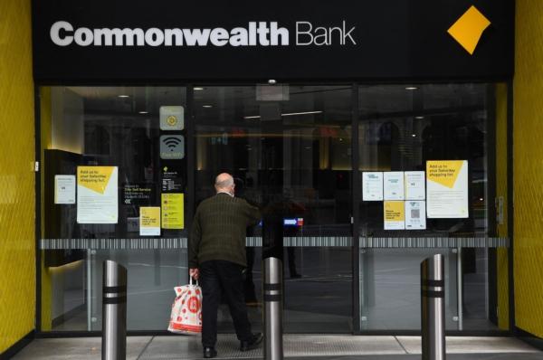 A man enters a branch of the Commonwealth Bank of Australia (CBA) in Melbourne, Australia, on Aug. 11, 2021. (William West/AFP via Getty Images)