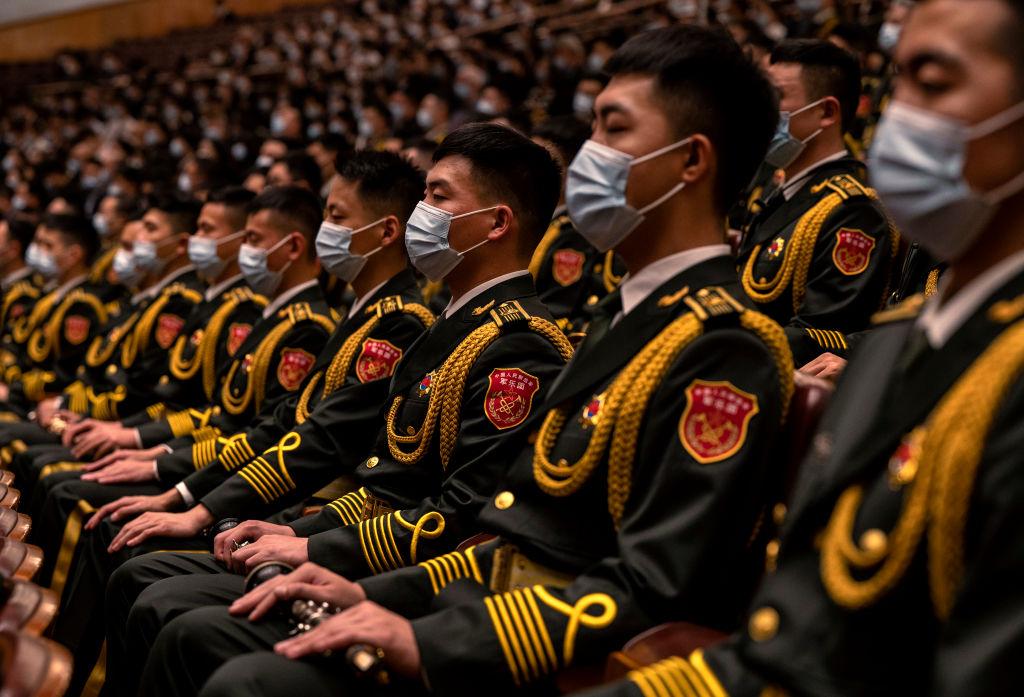 Members of the Peoples Liberation Army band are seated during the Opening Ceremony of the 20th National Congress of the Communist Party of China, at The Great Hall of People, in Beijing, China, on Oct. 16, 2022. (Kevin Frayer/Getty Images)