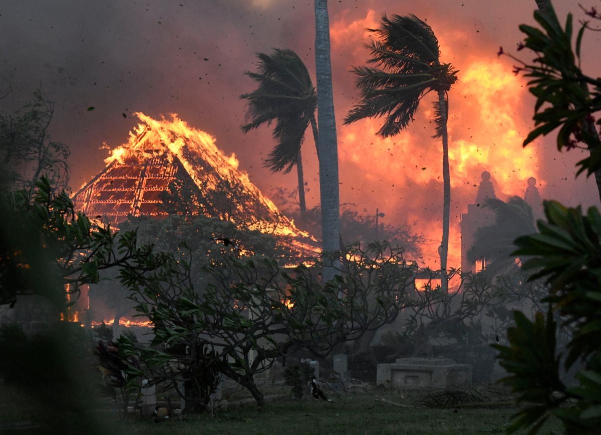 The hall of historic Waiola Church in Lahaina and nearby Lahaina Hongwanji Mission are engulfed in flames along Wainee Street in Lahaina, Hawaii, on Aug. 8, 2023. (Matthew Thayer/The Maui News via AP)