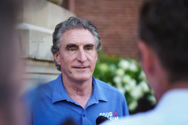 South Dakota Gov. Doug Burgum speaks with reporters at the Iowa State Fair in Des Moines, Iowa, on Aug. 11, 2023. (Madalina Vasiliu/The Epoch Times)