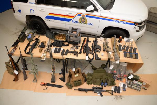 A photograph of the firearms, ammunition, and body armour seized by the RCMP at Coutts, Alberta, on Feb. 14, 2022. Courtesy of RCMP.