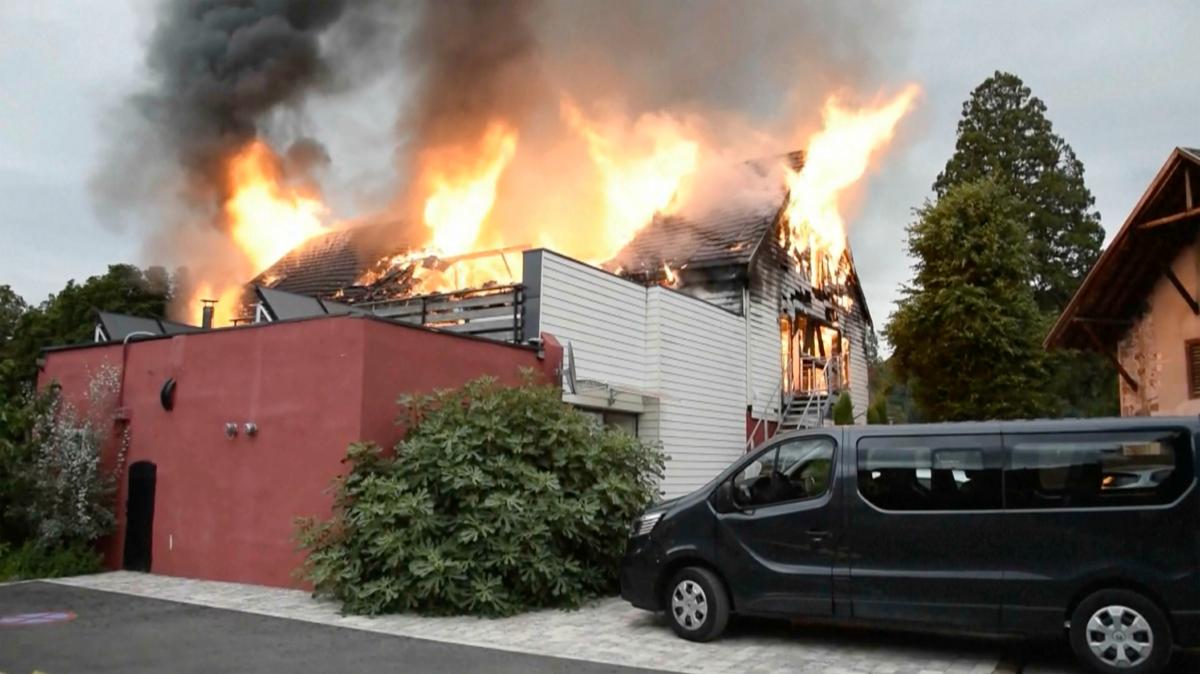 Fire rages at a vacation home in the town of Wintzenheim, north-eastern France, on Aug. 9, 2023. (TNN/dpa via AP)