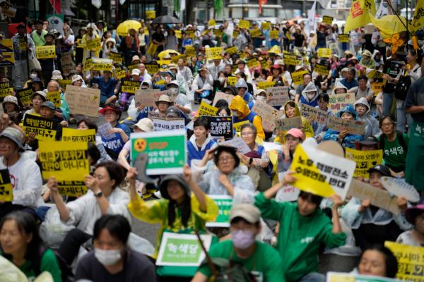 Members of civic groups shout slogans during a rally to oppose the Japanese government's plan to release treated radioactive water into the sea from the damaged Fukushima nuclear power plant, in Seoul, South Korea, on Aug. 12, 2023. (AP Photo/Lee Jin-man)