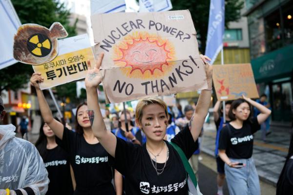 South Koreans shout slogans during a rally to oppose the Japanese government's plan to release treated radioactive water into the sea from the damaged Fukushima nuclear power plant, in Seoul, South Korea, on Aug. 12, 2023. (AP Photo/Lee Jin-man)