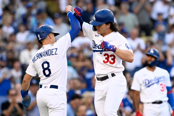 Los Angeles Dodgers' Kiké Hernández, left, celebrates at the plate with James Outman (33) after Outman hit a two-run home run against the Colorado Rockies during the second inning of a baseball game in Los Angeles on Aug. 12, 2023. (Alex Gallardo/AP Photo)