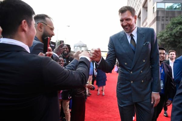 Dirk Nowitzki greets fans as he arrives on the red carpet for his enshrinement at the Basketball Hall of Fame in Springfield, Mass., on Aug. 12, 2023. (Jessica Hill/AP Photo)