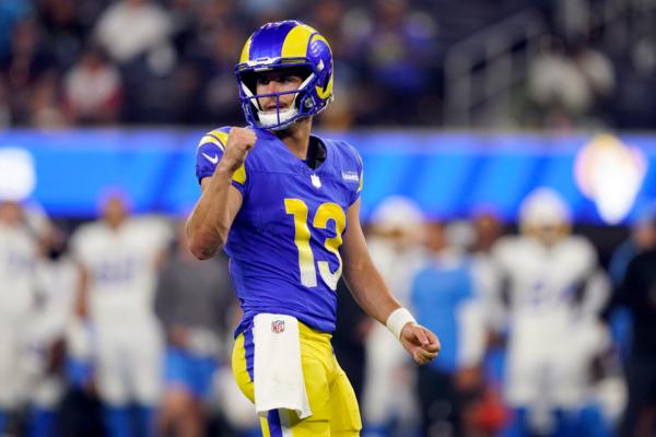 Los Angeles Rams quarterback Stetson Bennett (13) celebrates after a defensive holding call during the second half of a preseason NFL football game against the Los Angeles Chargers in Inglewood, Calif., on Aug. 12, 2023. (Ryan Sun/AP Photo)