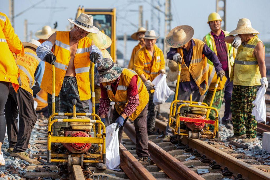 Workers construct a railway line in Haian, in China's eastern Jiangsu province on Aug. 9, 2023. (STR/AFP via Getty Images)