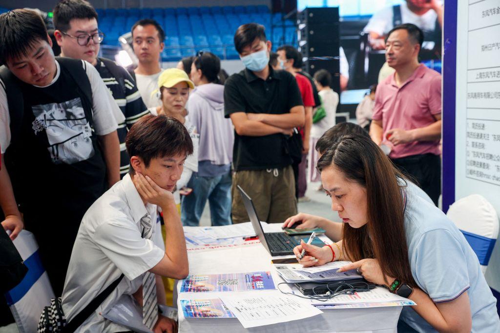 University graduates attend a job fair in Wuhan of China's central Hubei province, on Aug. 10, 2023. (TR/AFP via Getty Images)