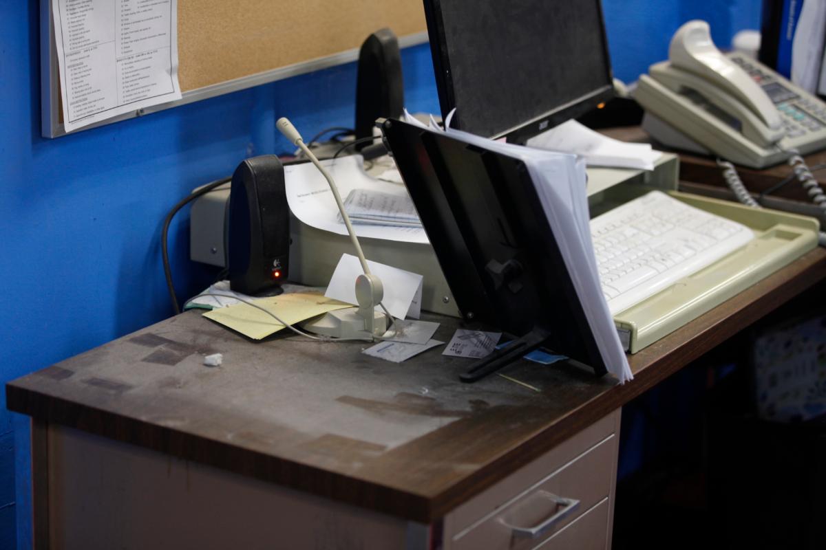  An empty spot on reporter Phyllis Zorn's desk shows where the tower for her computer sat before law enforcement officers seized it in a raid on the Marion County Record, in Marion County, Kan., on Aug. 13, 2023. (John Hanna/AP Photo)