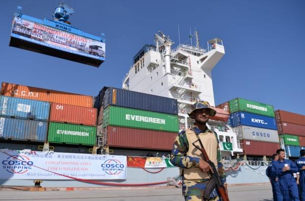 Pakistani naval personnel stands guard near a ship carrying containers at the Gwadar port during the opening ceremony of a pilot trade program between Pakistan and China on Nov. 13, 2016. (Aamir Quereshi/AFP via Getty Images)