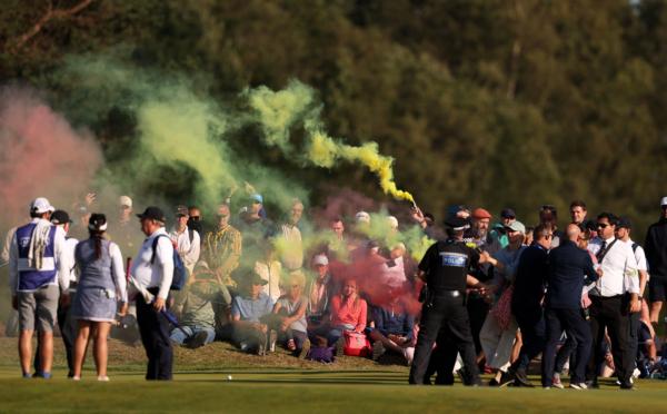 Protestors make their way onto the 17th green on Day Four of the AIG Women's Open at Walton Heath Golf Club in Tadworth, England, on August 13, 2023. (Warren Little/Getty Images)