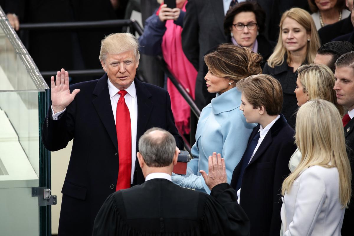 Supreme Court Justice John Roberts (2nd L) administers the oath of office to U.S. President Donald Trump (L) as his wife Melania Trump (3rd L) holds The Bible and son Barron Trump looks on, at the U.S. Capitol in Washington on Jan. 20, 2017. (Drew Angerer/Getty Images)