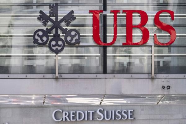 The logos of the Swiss banks Credit Suisse and UBS are pictured in Zurich, on June 12, 2023. (Ennio Leanza/Keystone via AP)