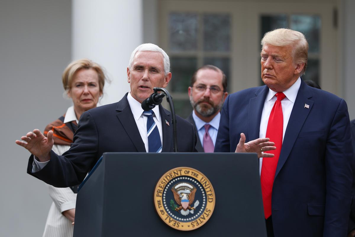 Vice President Mike Pence, flanked by officials and business leaders, speaks to the media after President Donald Trump announced a national emergency with regard to COVID-19 in the White House Rose Garden on March 13, 2020. (Charlotte Cuthbertson/The Epoch Times)