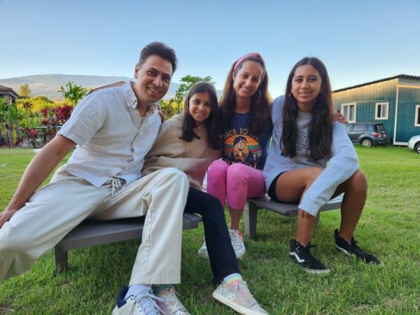 Mikunda Singh (L), his wife Tina, and their two young daughters were vacationing north of Lahaina when the fire broke out on Aug. 8, 2023. (Allan Stein/The Epoch Times)