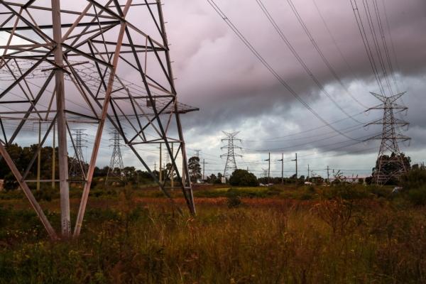 High voltage electricity transmission towers near the Hunter Wetland National Park in Newcastle, Australia, on April 14, 2023. (Roni Bintang/Getty Images)